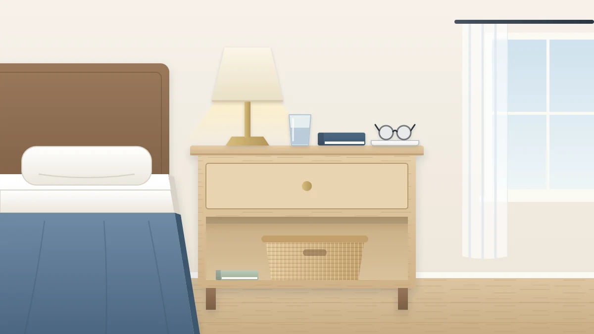 A wooden nightstand beside a bed with a blue duvet: a lamp, a closed book, glasses on a tray and a glass of water, with a basket on the lower shelf